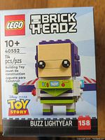Front of the sealed LEGO BrickHeadz box for Buzz Lightyear set #40552 showing the assembled character and official logos.