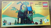 Front of the LEGO box showing the Forest Hideout build with treehouse and archers, piece count 258.
