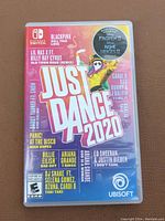 Front cover of Just Dance 2020 Nintendo Switch game case showing cover art with featured artists and songs.