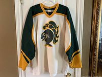 Front view of white jersey hanging