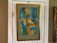 Front view of the framed original watercolour painting showcasing the abstract blue, green, yellow, and orange composition.
