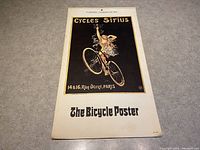 Photo showing full front view of the 1975 calendar titled 'The Bicycle Poster' with the artwork and text clearly visible.