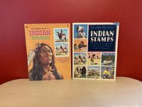 Front covers of two vintage Indian stamp books, showing titles and cover artwork