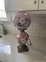 Lamp unlit showing color and floral detail under natural light