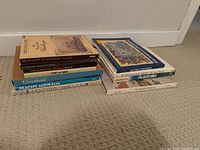 Stack of non-fiction books showing titles such as The Voice of the Challenger, Treasures of Tutankhamen, Greenland, Peach's Australia, Footsteps of Marco Polo.