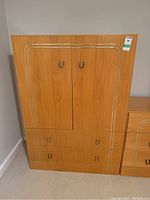 Front view of Princeville wardrobe showing two doors with metal handles and two drawers below.