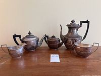 Group shot of all five pieces on wooden surface