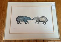 Full front view of framed lithograph on hardwood floor