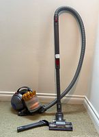 Full assembly showing canister, hose, wand and floor head