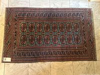 Overhead full view of rectangular rug on marble floor