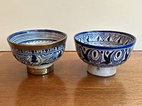 Two hand-painted Moroccan blue and white ceramic bowls side by side