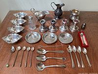 Overview of all silver pieces arranged on table