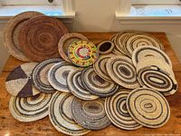 All pieces arranged on wooden table under window