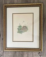 Framed print showing full artwork and frame with some glare, photo to illustrate size and overall condition.