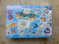 Box showing Aquabeads branding and image of set, 1500 pieces