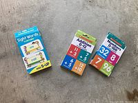 Photo of three educational flash card sets including sight words and math.