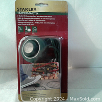 Front view of Stanley Tappermax extension cord in sealed packaging showing brand, product name, length (9 ft / 2.7 m) and 3 outlets.