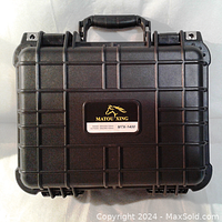Closed black Matou Xing MTX-1400 hard shell protective case with handle and reinforced textured exterior.