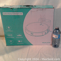 Box of the K10 robot vacuum cleaner and mop combo showing 2000Pa suction, WiFi, smart mopping, and other features.