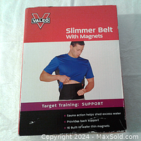 Box front showing male model wearing Valeo slimmer belt with magnets, product features labeled.