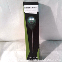 Photo showing full length of soil moisture meter in original packaging labeled 'Soil Tester'
