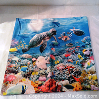 Throw pillow case displaying a detailed coral reef scene with a large turtle and many colorful tropical fish underwater.
