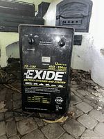 Front view of Exide 70-100 battery charger and starter, showing brand, model and main specifications.