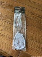 Deluxe Minnow Net sealed in packaging with labeled header card.