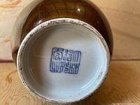 Bottom of the vase showing the blue-white reign mark on the base, confirming the Chinese origin and period.