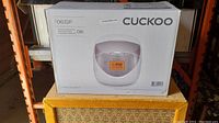 Front side of the Cuckoo rice cooker box showing model 0632F and product image.