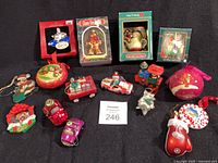 Group shot of all fourteen ornaments including four boxed items and ten loose pieces