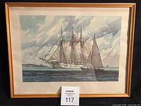 Full view of framed print showing image, frame and artist signature