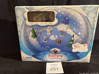 Front of box showing Rudolph Music & Motion Bumble Chase scene