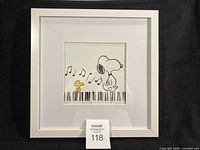 Full view of framed Snoopy and Woodstock print with lot tag