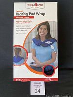 Front of sealed TheraCare personal heating pad wrap retail box