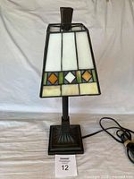 Full view of Tiffany style stained glass desk lamp showing shade, stand, cord and size reference