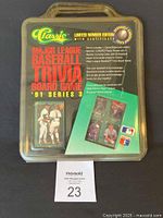 Front view of sealed board game in plastic carrying case with logo and series information visible