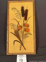 Full view of framed cattail yarn art