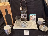 Group shot showing all items: wine box, tray, tote, recipe glass, sugar bowl, teacups, mugs, markers pack, stainless dish