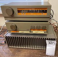 Three Quad components stacked: FM tuner on top, preamplifier center, power amplifier bottom