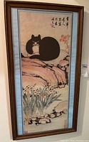 Full view of framed cat wall art hung on wall