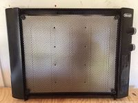 Front view of black metal wall mount heater with mesh grille and DeLonghi logo.