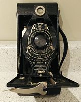 Front view of Eastman Kodak Co. No. 116 folding camera showing lens, shutter, and branding plate with model details.