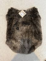 Photo of the full faux fur dog coat showing the texture and shape.