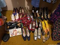 Overview of multiple pairs of women’s shoes in various styles and colors