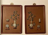 Both panels side by side showing frames, inlaid vases, branches, and small carvings