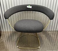 Front view of chair showing curved back cushion and base