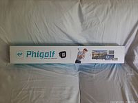 Full photo of the original white box packaging with Phigolf logo and product image.