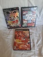 Three PlayStation 2 video game cases shown together, titles visible.