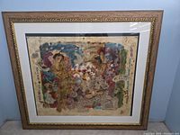 Full view of framed serigraph showing overall artwork and original ornate frame